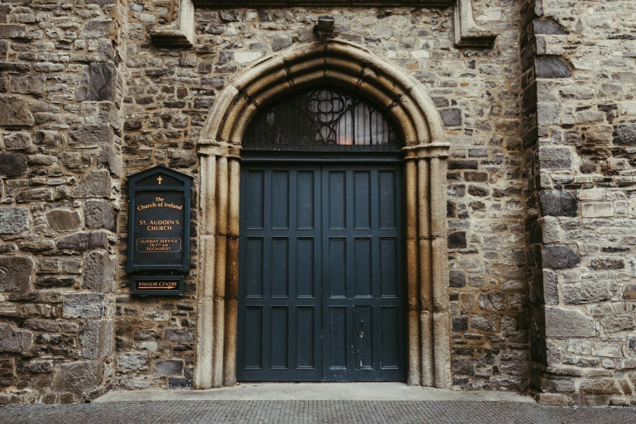 Historic St. Audoen's Church entrance with stone architecture in Dublin, Ireland.